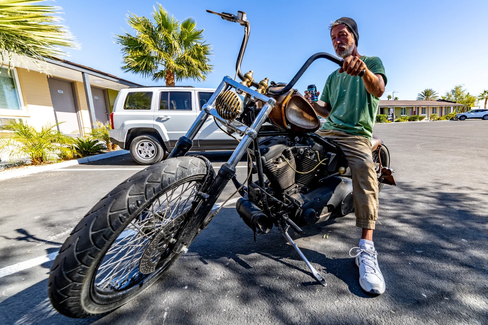 Environmental lifestyle portrait with custom motorcycle