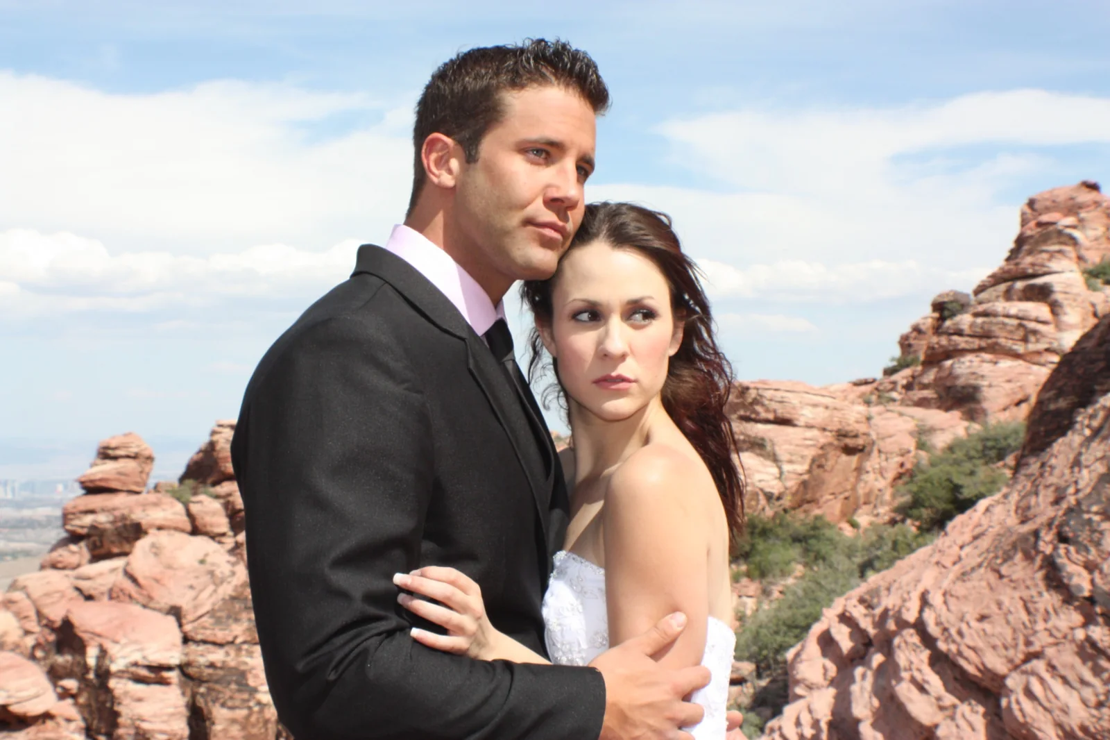 Environmental editorial portrait of a couple in a desert landscape