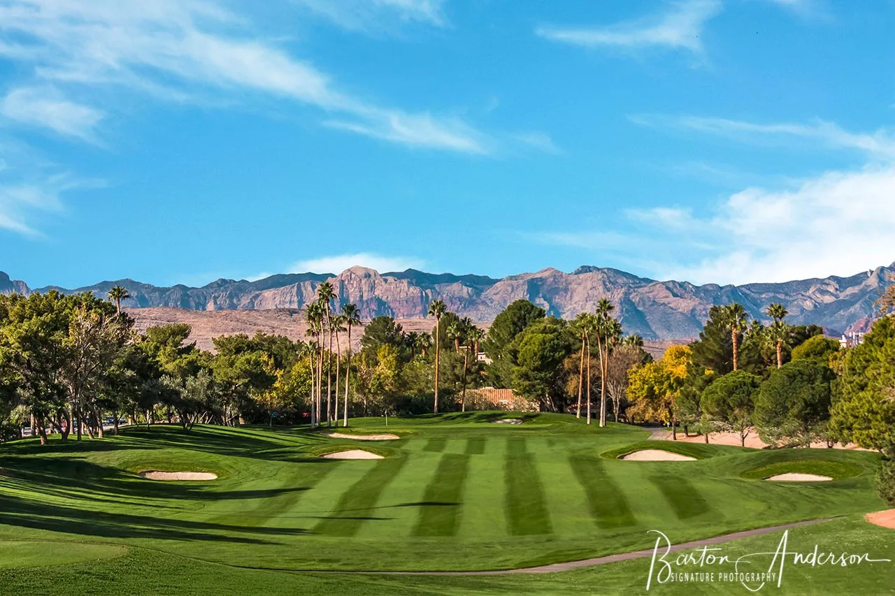 Wide golf fairway and mountain landscape